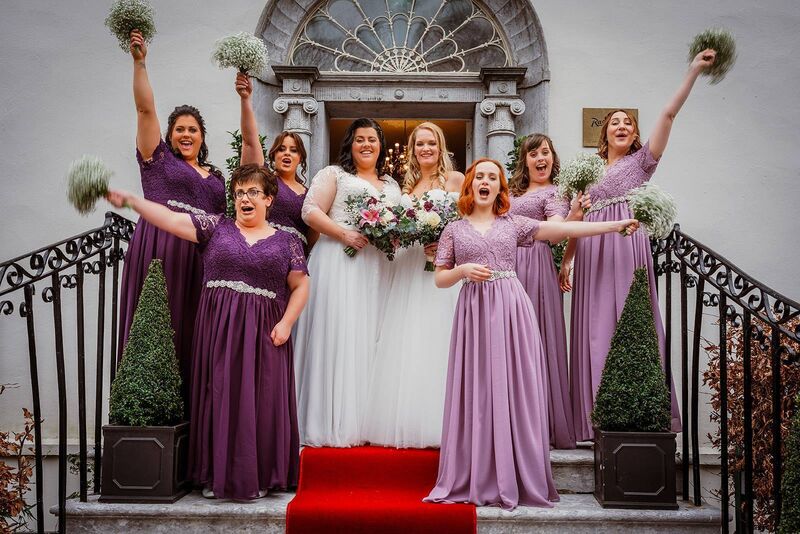 Pictured with their wedding party.