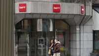 Businessman's claim against Davy and 16 former employees is struck out as part of settlement