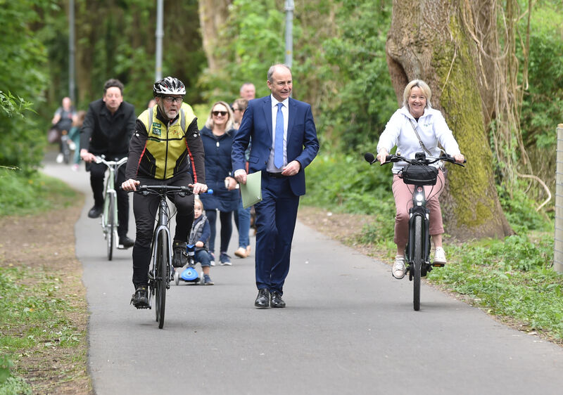 An Tanaiste Michéal Martin chatting with Helen Guinan, chairperson Cork Cycling campaign at the opening of phase one of the Marina to Passage West Greenway. Picture; Eddie O'Hare