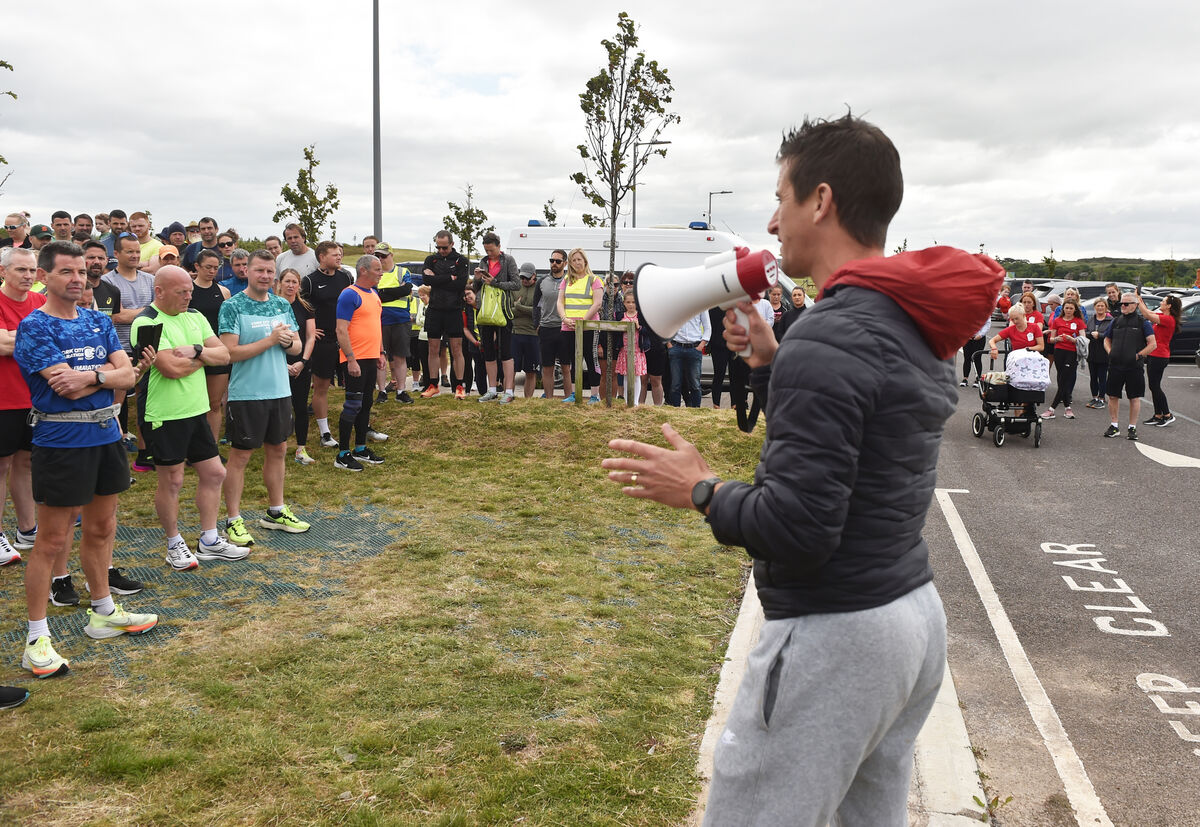  19th June 2022 Former Olympian Rob Heffernan starts off the runners and walkers taking part in Challenge 21 fundraiser in aid of The Down Syndrome centre in Cork from Haulbowline to Pairc Ui Chaoimh. Picture; Eddie O'Hare