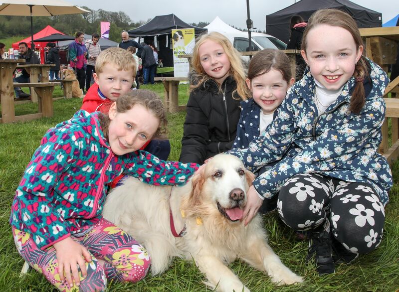 Laoise Ní Chonchúir, Seán McCarthy, Ava McCarthy, Kate and Emma Coughlan and their Golden Retriever Ali at the Pups in the Park event that was held at the Showgrounds in Curraheen. Pic: David Creedon