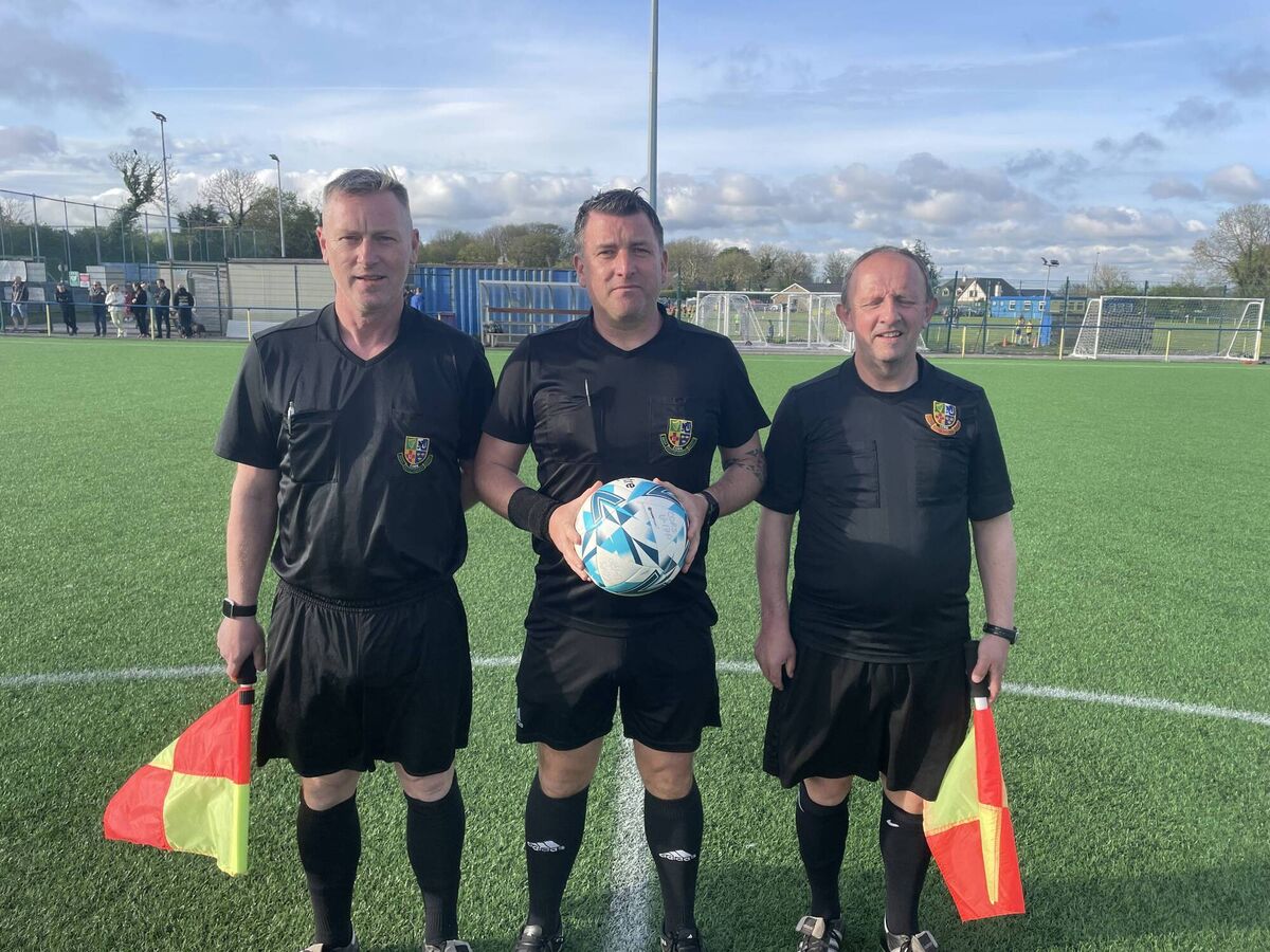 Referee Dave Finnegan with his assistant’s Pat O’Keeffe and Paul Bowdren before the Under 17 Premier League playoff semifinal at Moneygourney last Tuesday night.