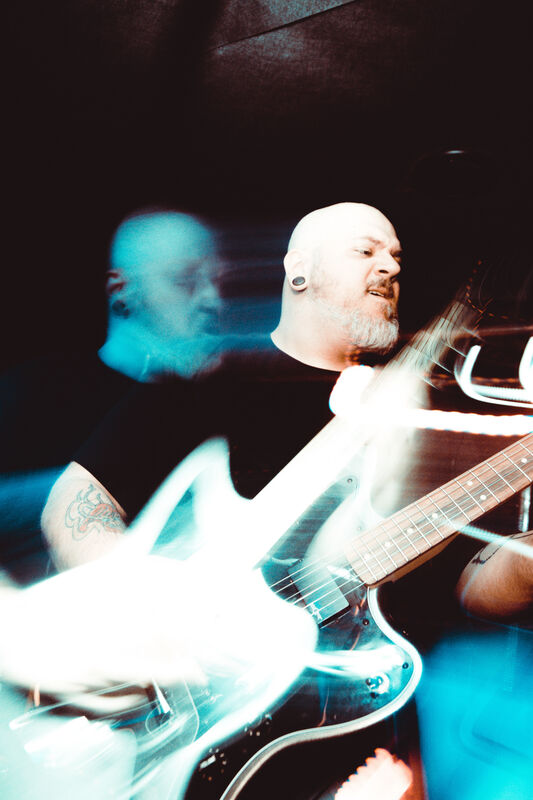 Worn Out guitarist Alex Heinrich, currently seeking an autism diagnosis, in action at a gig in Scotland