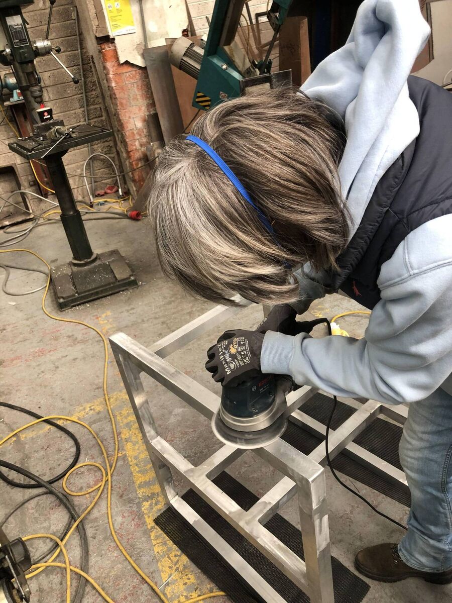 Di Curtin working on her art. Di Curtin working on her art.