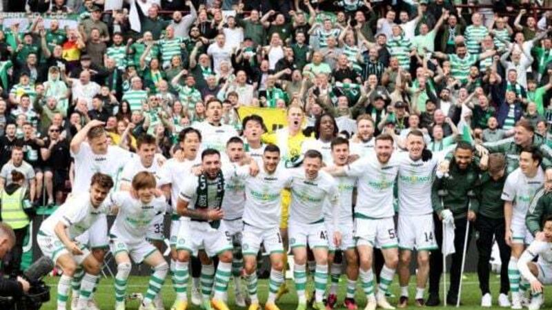Celtic wrap up league title with victory at 10-man Hearts