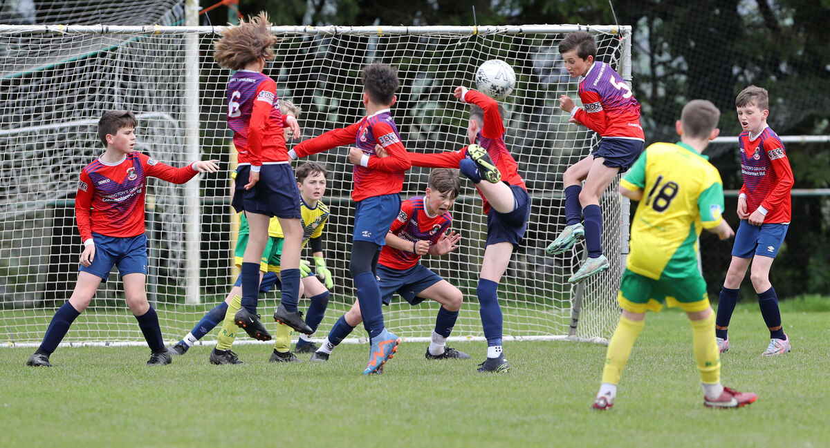  Springfield Ramblers defend a free kick from Cillian McSweeney, Rockmount. Picture: Jim Coughlan.