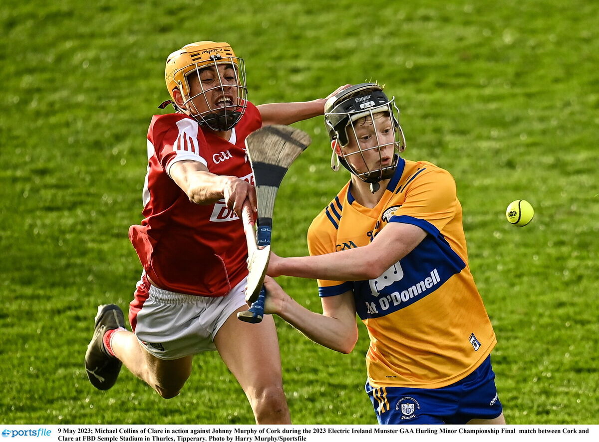 Michael Collins of Clare in action against Johnny Murphy of Cork during the 2023 Electric Ireland Munster GAA Hurling Minor Championship Final match between Cork and Clare at FBD Semple Stadium in Thurles, Tipperary. Photo by Harry Murphy/Sportsfile