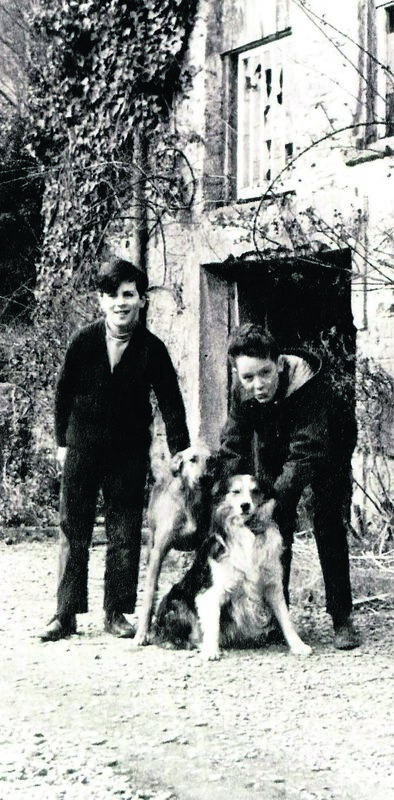 Gerard Martin O’Brien’s brother Pat (left) and a friend with the family dogs. Gerard recalls walking through the Glen on dark nights before street lighting lit up the way