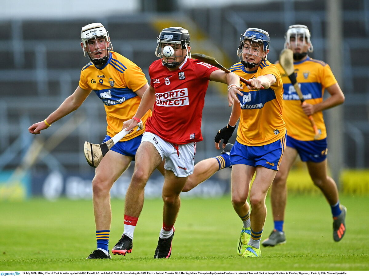 Mikey Finn of Cork in action against Niall O'Farrell and Jack O'Neill of Clare in 2021. Picture: Eóin Noonan/Sportsfile Mikey Finn of Cork in action against Niall O'Farrell and Jack O'Neill of Clare in 2021. Picture: Eóin Noonan/Sportsfile