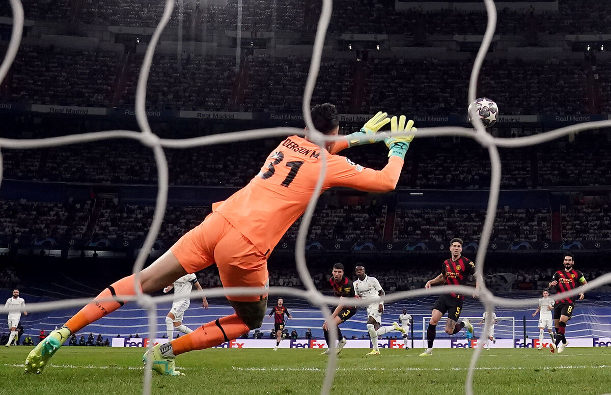 Real Madrid's Vinicius Junior scores despoite the efforts Man City's Ederson during the UEFA Champions League, semi-final, first leg match at the Santiago Bernabeu Stadium in Madrid, Spain. Picture: Nick Potts/PA Wire