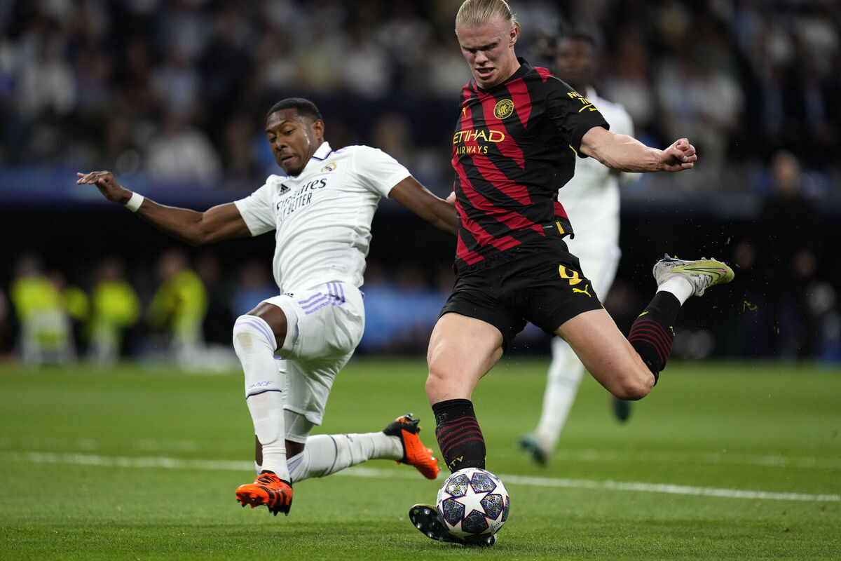 Real Madrid's David Alaba slides in to block a shot by Manchester City's Erling Haaland  at the Santiago Bernabeu stadium Picture: AP Photo/Manu Fernandez