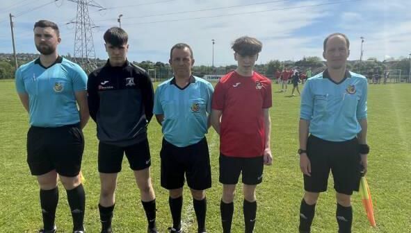 Referee Stephen Moore and his assistants Yves Kriwan and Alan Kelly with the Leeside captain John Dunlea and Grenagh United captain Nathan O’Connell before the U17 League 2 playoff. 