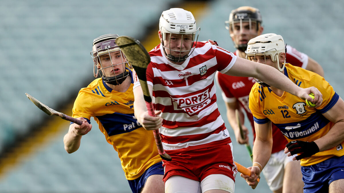 Cork goalkeeper Brion Saunderson with David Kennedy and Keith Smyth of Clare. Picture: INPHO/Ben Brady