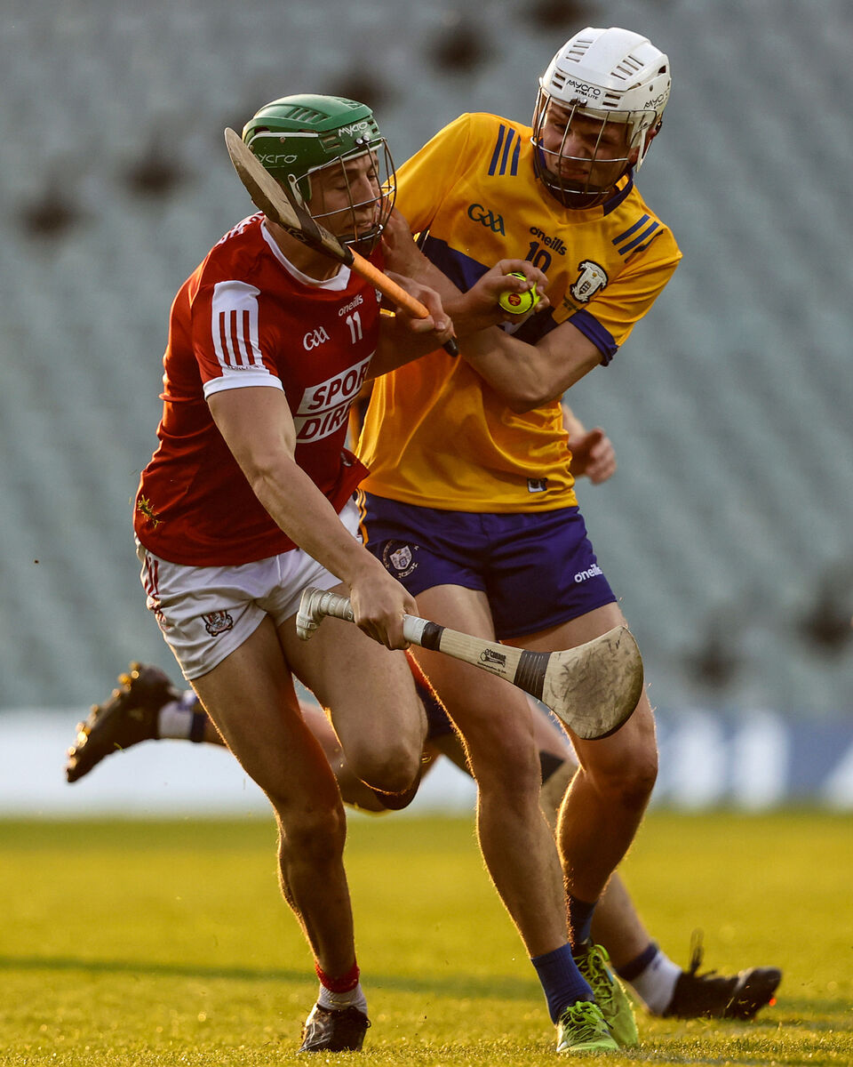 Cork's Ben Cunningham comes up against Oisín O'Donnell of Clare. Picture: INPHO/Ben Brady