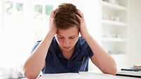 Depressed Boy Studying At Home