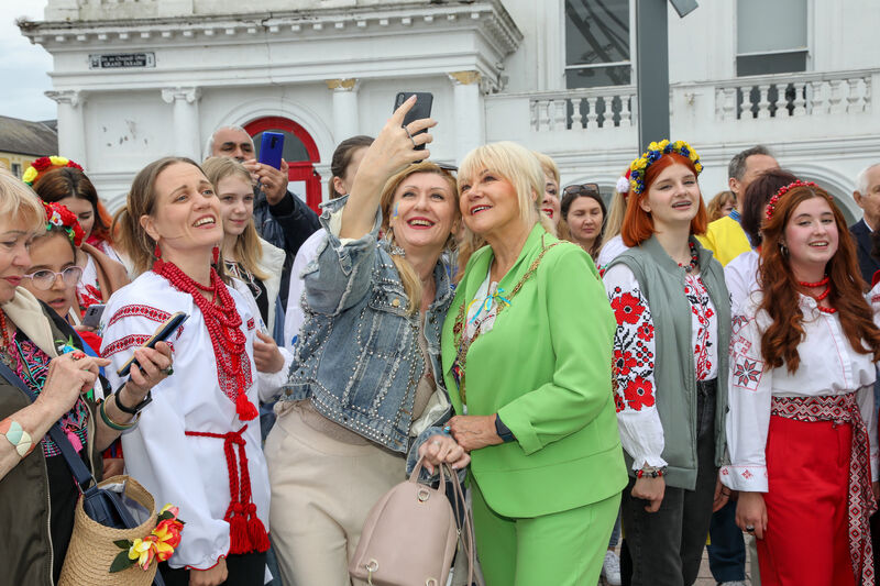 Lord Mayor of Cork, Cllr Deirdre Forde, takes a selfie taking with Ukrainain refugees who were taking part in Vyshyvanka Day on Grand Parade, Cork.  Picture: David Creedon