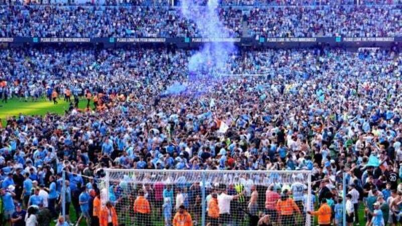Manchester City players and fans celebrate step one of the treble Manchester City players and fans celebrate step one of the treble