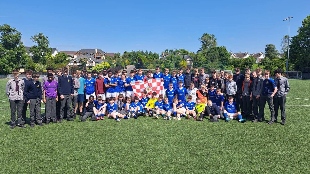 The Midleton CBS U15 Cork FAI Schools Minor Cork Cup winners with supporters.
