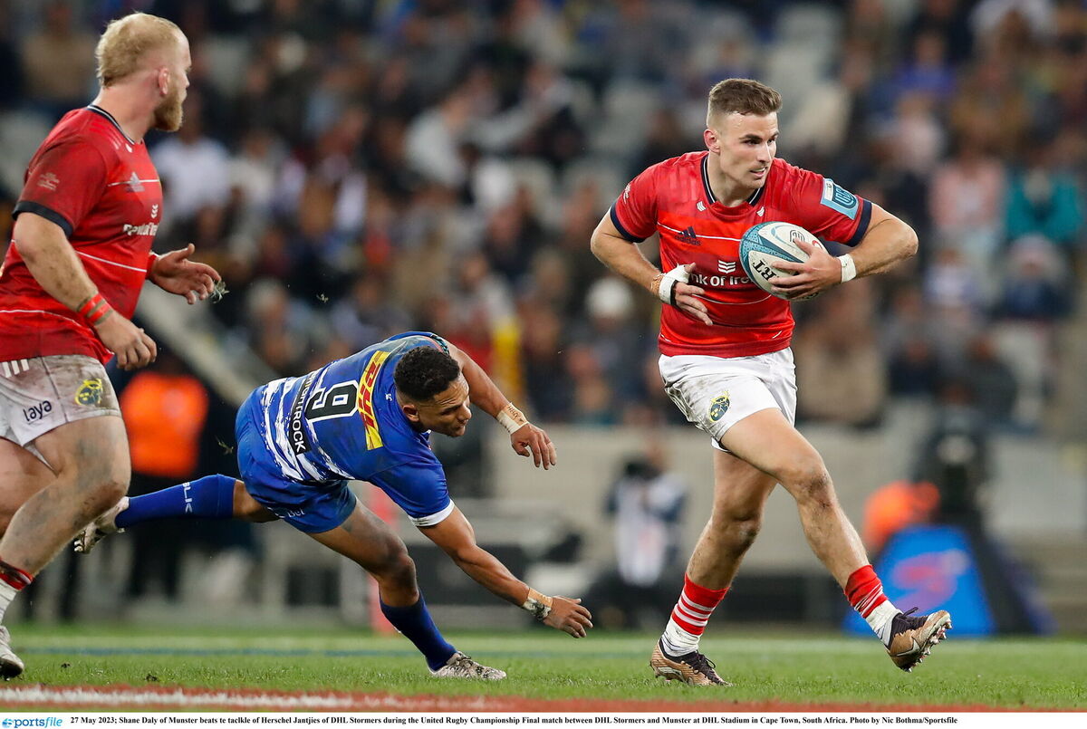 Shane Daly of Munster beats the tackle of Herschel Jantjies of DHL Stormers. Picture: Nic Bothma/Sportsfile