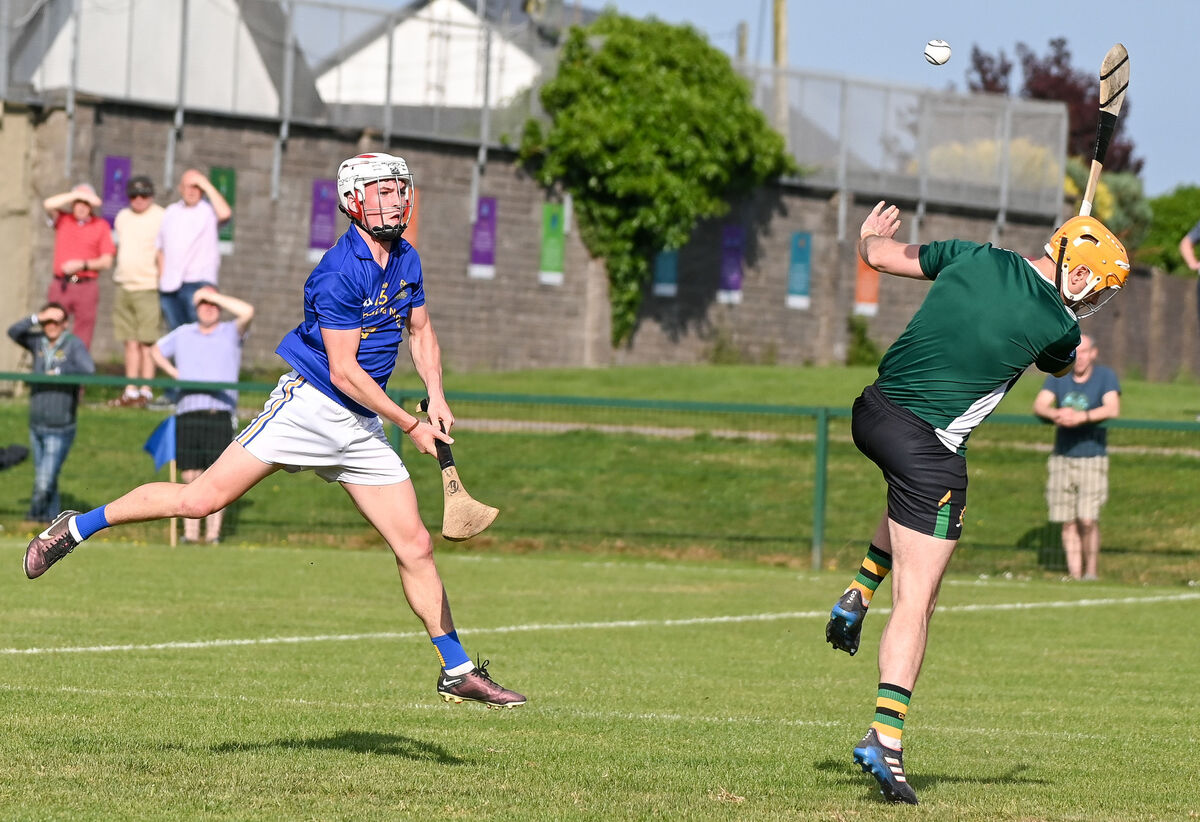 St Finbarr's John Wiggington-Barrett bats the ball to the Glen Rovers net past Cathal Hickey. Picture: David Keane. St Finbarr's John Wiggington-Barrett bats the ball to the Glen Rovers net past Cathal Hickey. Picture: David Keane.