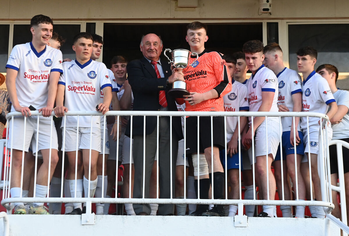 Richard Browne Cork Youth presents the trophy to Blarney United captain Jack Forde after defeating Carrigline United in the under 18 Murphy cup youth final at Turner's Cross. Picture; Eddie O'Hare