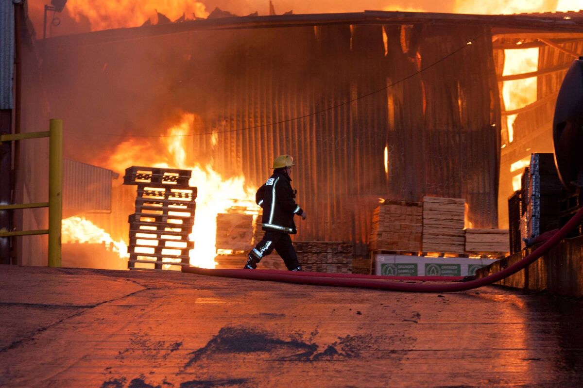 Firefighters attending the scene of a blaze at Mid Cork Pallets in 2011. Picture: John Delea.