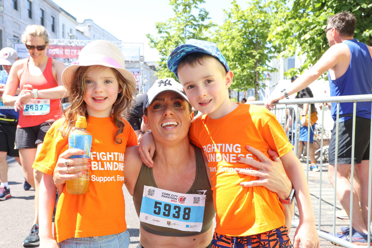 Lisa Delaney with Cathal and Caragh Sheehan, Blarney St at the 2023 Cork City Marathon. Photo: Darragh Kane