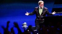 Elton John greets Manchester City’s FA Cup winners at airport