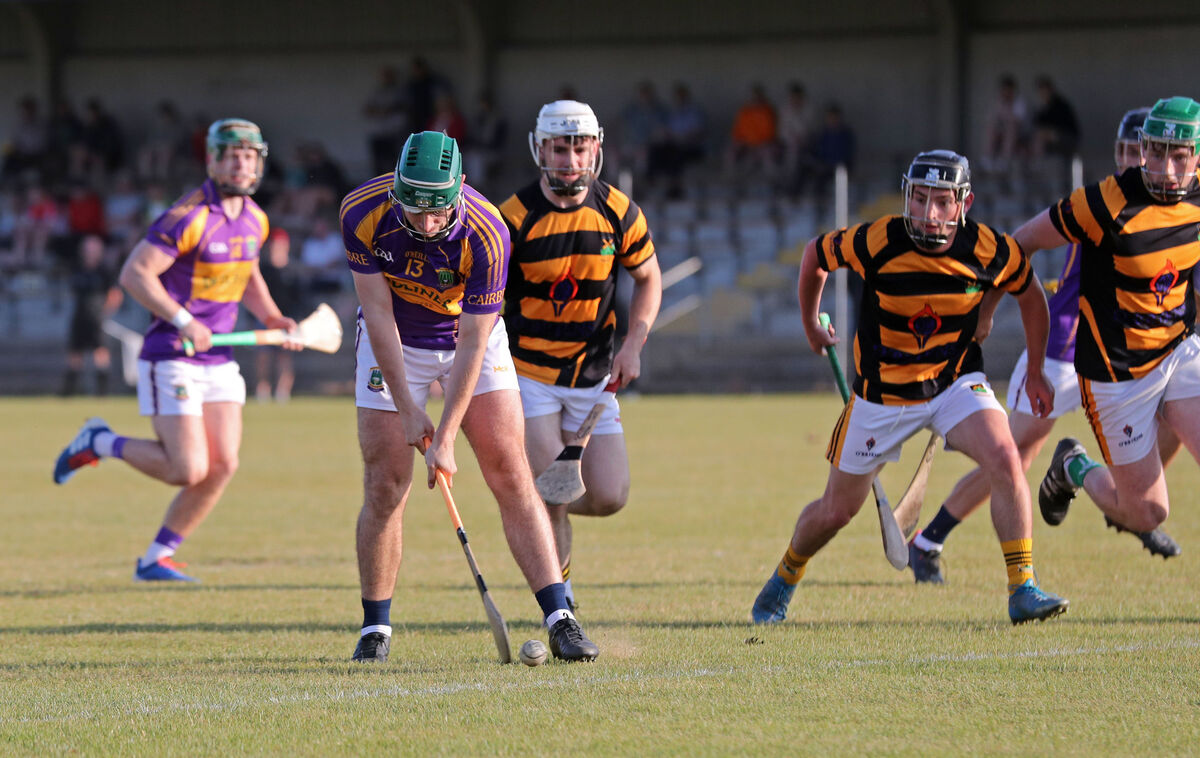  Brian O'Donovan, Carbery, strikes the ball resulting in a goal, under pressure from the Avondhu defense.