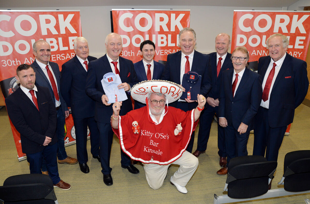 Michael Moore and Tommy McGreevy, both of Cork Penny Dinners; Billy Morgan, manager/coach of the football team; Larry Tompkins, captain of the football team; Luke O'Sullivan, Suits Distributors; Tomás Mulcahy, captain of the hurling team; Teddy McCarthy, dual star; Gerald McCarthy, trainer of the hurling team, and Dr Con Murphy, team doctor with both teams. At the front is Cork supporter Cyril Kavanagh. Picture: Denis Minihane.