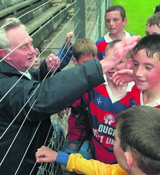 MENTOR: Sean, a past pupil of Greenmount School, congratulating their players after they beat Blarney in a Sciath Na Scol final at Pairc Ui Rinn in 1997