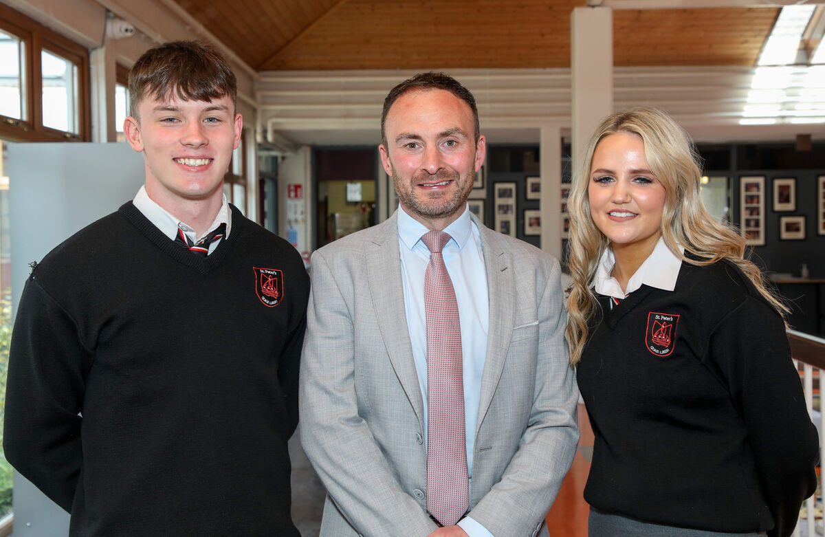 Leaving Cert students Cian Linehan and Brooke Matthews with principal Tony McSweeney at the Leaving Cert graduation at St Peter's Community School in Passage West. Picture: David Creedon