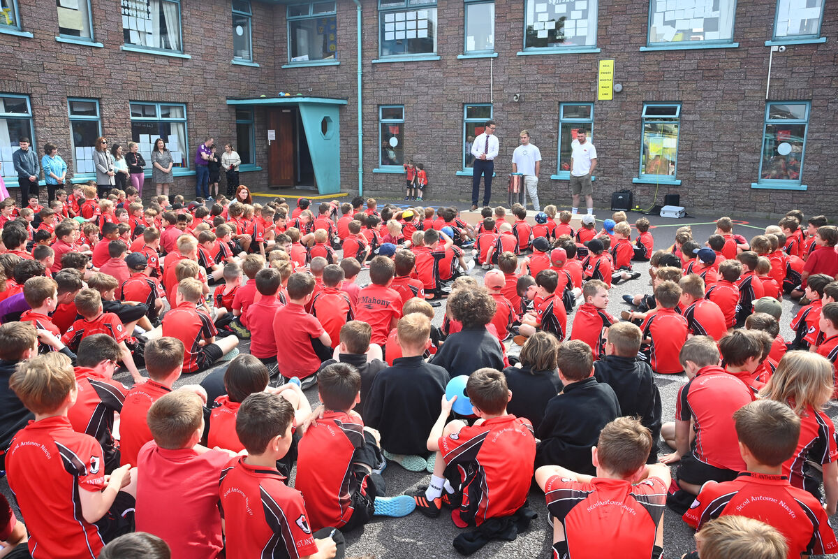 Principal Sean Lyons welcomes Munster Rugby players (left) Alex Kendellen and Peter O'Mahony who brought the United Rugby Championship (URC) trophy to St Anthony's BNS, Ballinlough. Pic: Larry Cummins Principal Sean Lyons welcomes Munster Rugby players (left) Alex Kendellen and Peter O'Mahony who brought the United Rugby Championship (URC) trophy to St Anthony's BNS, Ballinlough. Pic: Larry Cummins