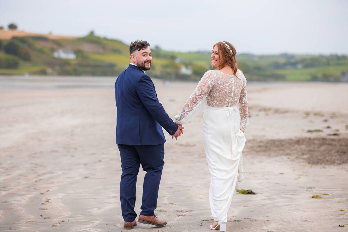 The happy couple walking hand in hand. They first met in first year in secondary school - and got together in sixth year.