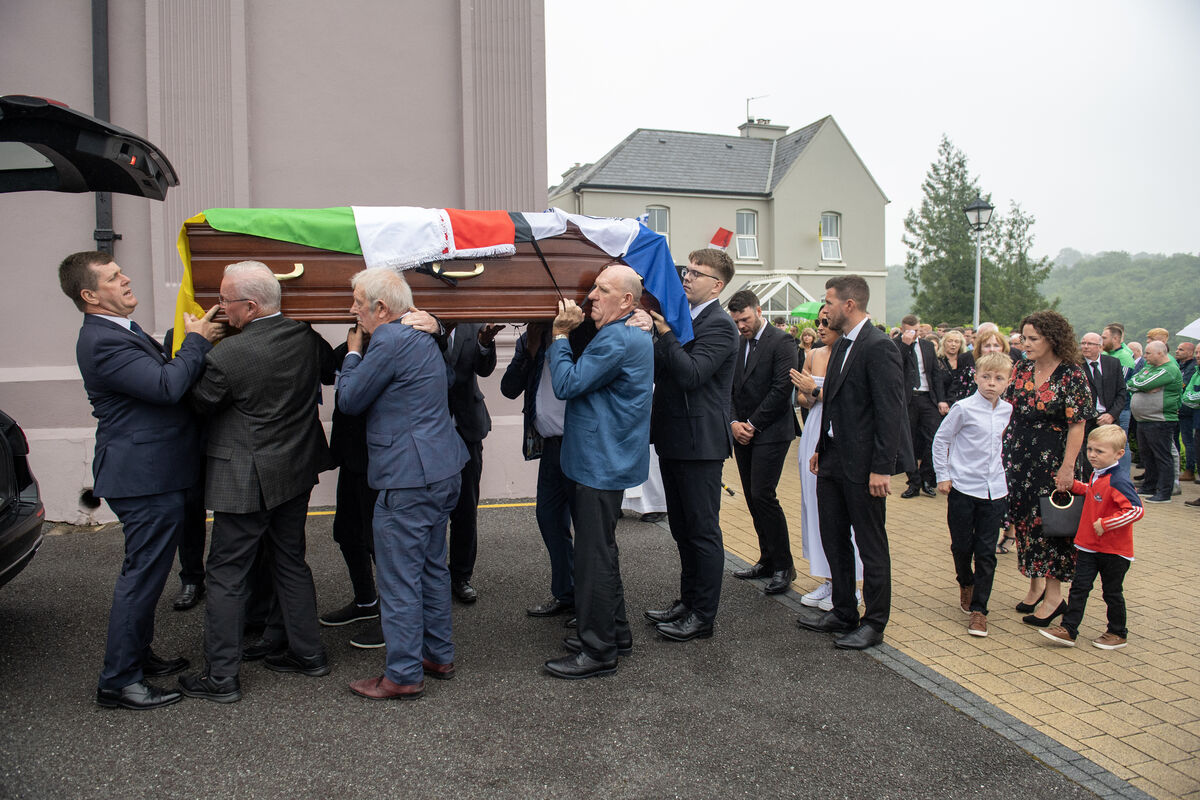 The coffin of the late Teddy McCarthy is shouldered from the church followed family members Oonagh her sons Niall and Cian, daughter Sinead and grandchildren Tiernan and Joey after requiem mass. Picture: Dan Linehan The coffin of the late Teddy McCarthy is shouldered from the church followed family members Oonagh her sons Niall and Cian, daughter Sinead and grandchildren Tiernan and Joey after requiem mass. Picture: Dan Linehan