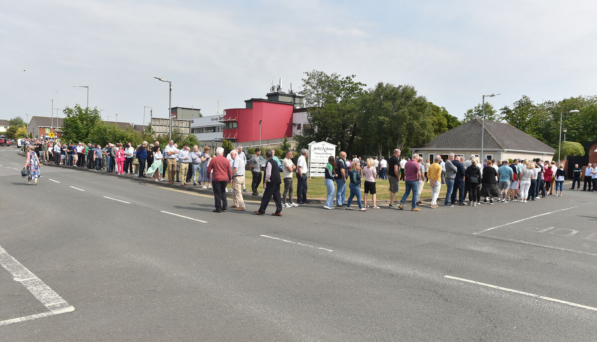 The large crowds pay their respects at the removal. Picture: Eddie O'Hare The large crowds pay their respects at the removal. Picture: Eddie O'Hare