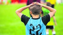 Disappointed Soccer Boy on Football Game. Kid Putting Hands on His Head After Loosing Goal
