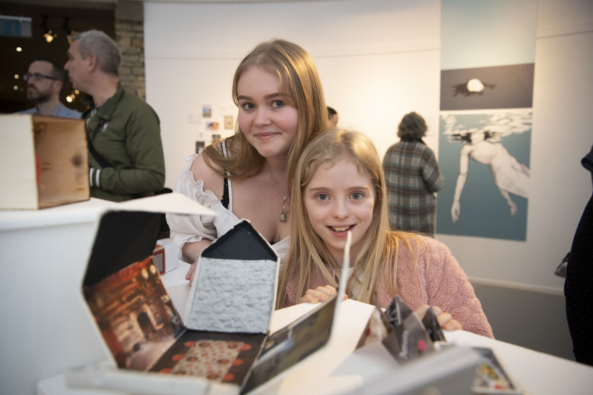 Emily Hofmann and Nessa O'Shea from Miltown, Co Kerry, enjoying the Civil War exhibits as part of Siamsa festivities in MTU Kerry Campus. They're pictured with Called Mise, le Meas, an innovative visual media project collaboration between the Animation, Visual Effects and Motion Design students at MTU Kerry Campus and the Learners of the Digital Design and Visual Communication, and the Animation (Creative Media) programme in Kerry College. Photo: Domnick Walsh 
