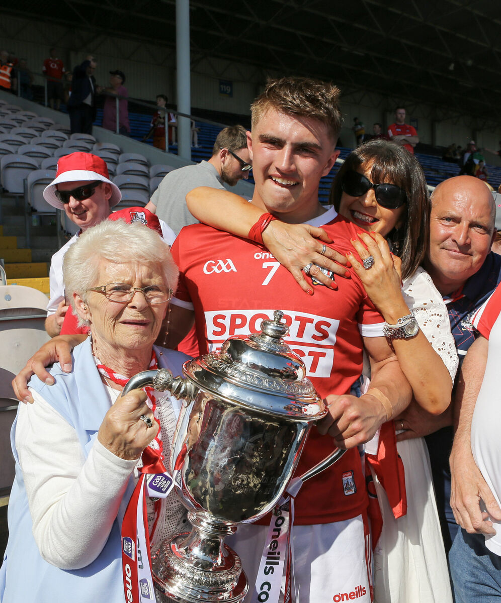 Cork U20 captain Micheál Mullins celebrates with his mother Christine, grandmother Esther and father Michael after beating Offaly. Picture: INPHO/Ken Sutton