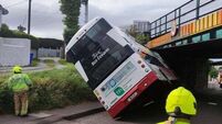 Double-decker bus crashes into Cork railway bridge