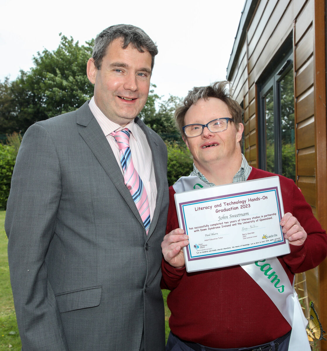 John Sweetnam receives his certificate from John Condon, Down Syndrome Ireland at a graduation ceremony for the Literacy and Technology programme at the Down Syndrome Cork Field of Dreams, Curraheen, Cork. - Picture; David Creedon