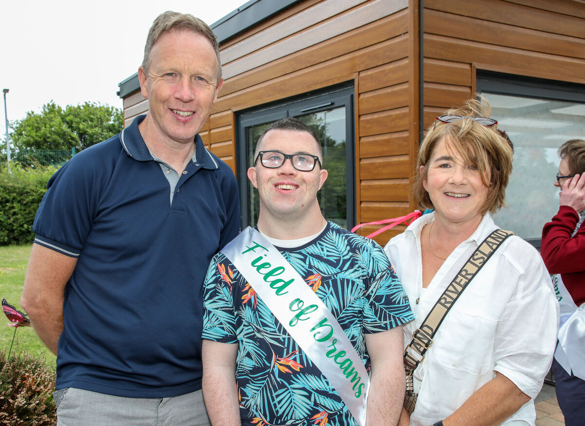 James Hanley with his parents Kevin and Kay at the graduation ceremony for the Literacy and Technology programme at the Down Syndrome Cork Field of Dreams, Curraheen, Cork. - Picture; David Creedon