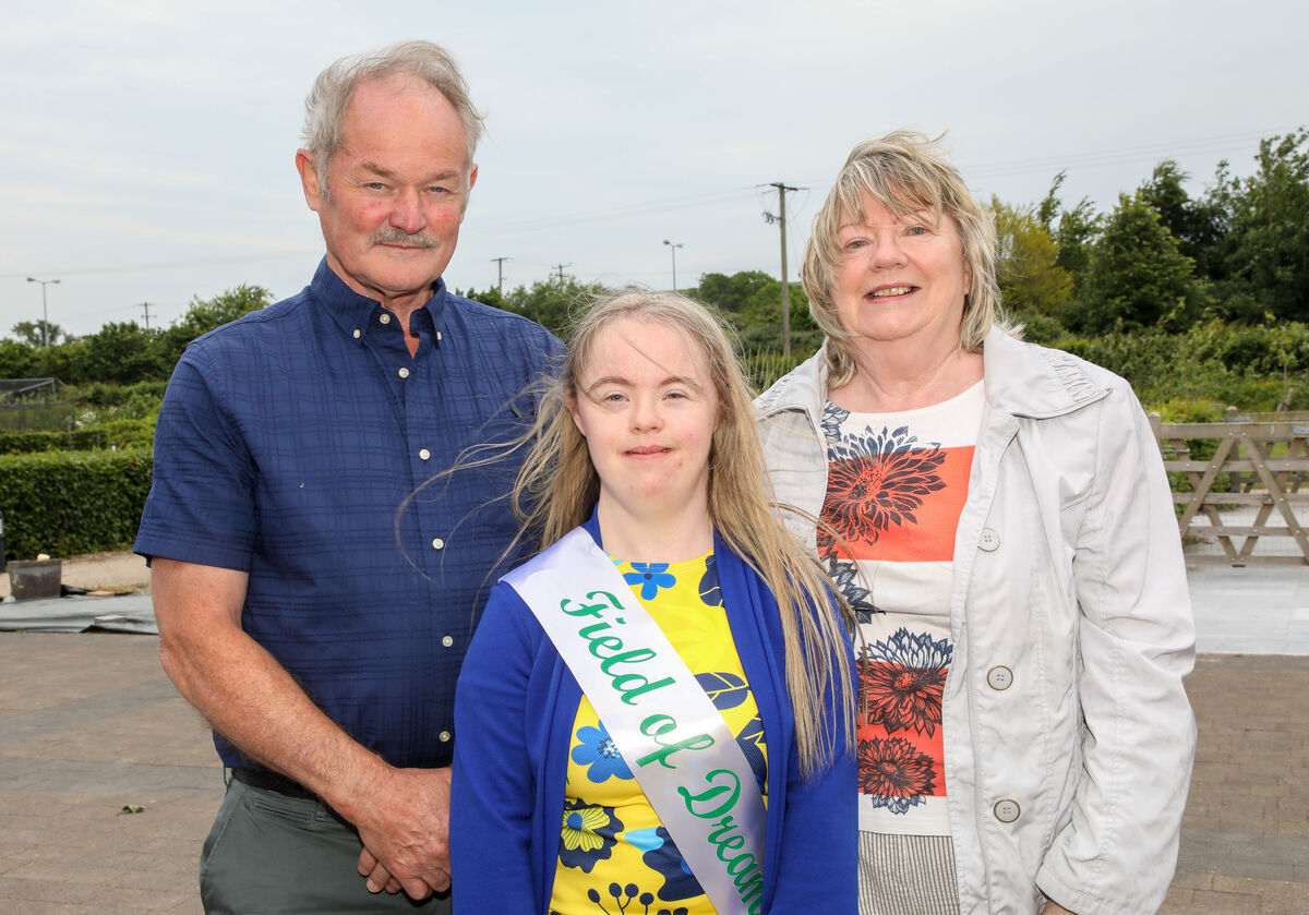 Jennifer O' Halloran with her parents Leonard and Margaret at the graduation ceremony for the Literacy and Technology and Ready 2 Work programme at the Down Syndrome Cork Field of Dreams, Curraheen, Cork. - Picture; David Creedon