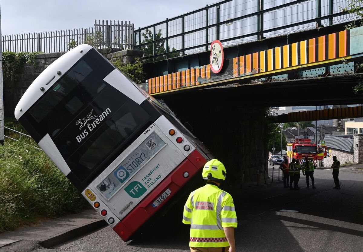 Emergency services at the scene after a Bus Éireann bus collided with the crash rail at a railway bridge at Dublin Hill, Cork. Picture Denis Minihane.