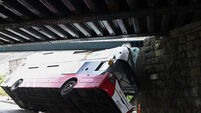 Latest: Road cleared and reopened after bus struck railway bridge 