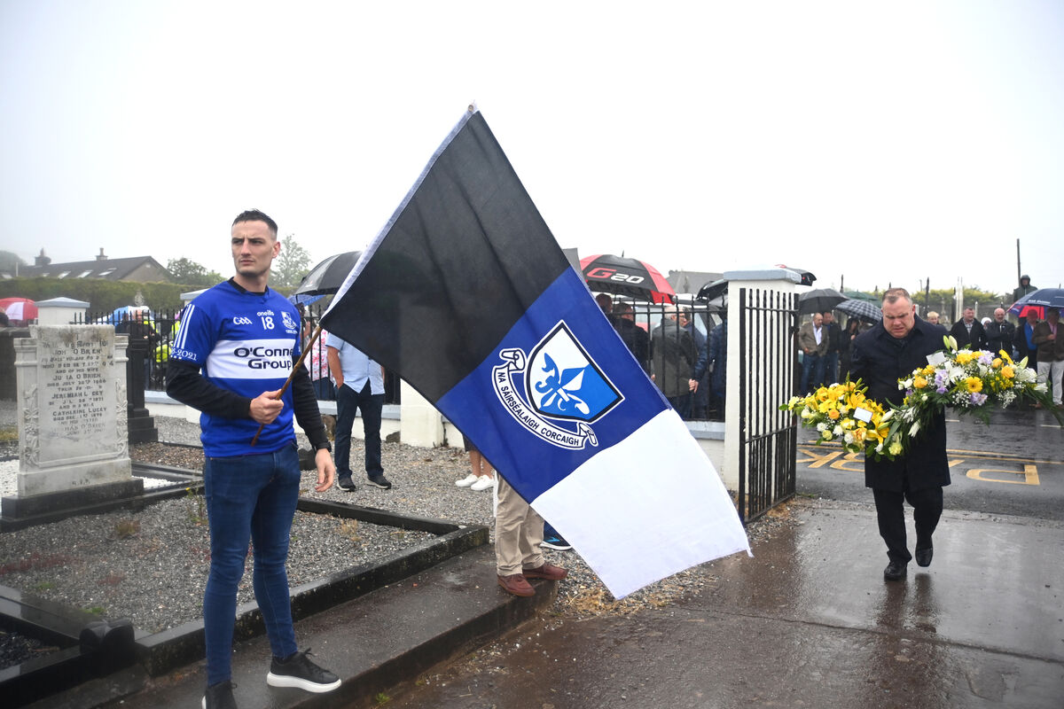 Sarsfield players formed a guard of honour for Cork sporting legend Teddy McCarthy as his remains were carried to his grave at Rathcooney Cemetery. Picture: Larry Cummins