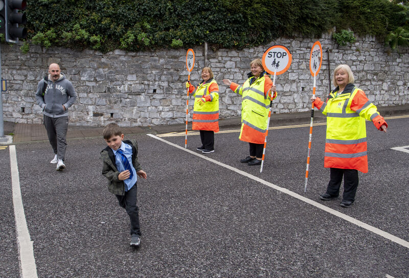 Irish professional boxer Spike O'Sullivan and his son Tommy crossing the road as they leave the Glasheen Boys national School with the help of the School warden sisters, Margaret, Deirdre ande Jean Picture: Dan Linehan Irish professional boxer Spike O'Sullivan and his son Tommy crossing the road as they leave the Glasheen Boys national School with the help of the School warden sisters, Margaret, Deirdre ande Jean Picture: Dan Linehan