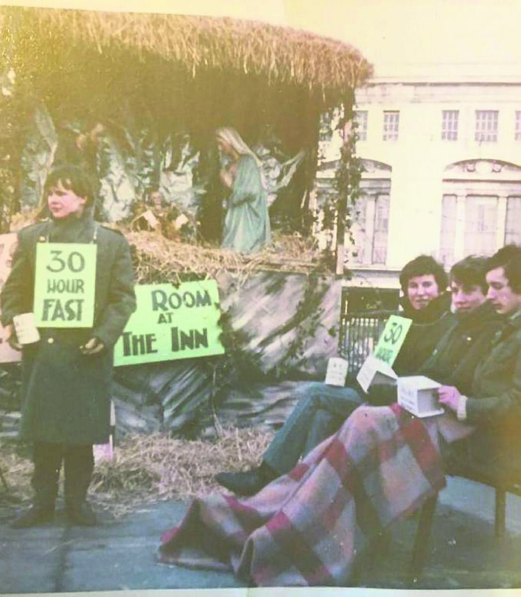 John Glasheen in blue jeans when fasting and collecting for SHARE back in 1970. John was on the inaugural committee for SHARE and now volunteers for the COPE Foundation in his retirement.