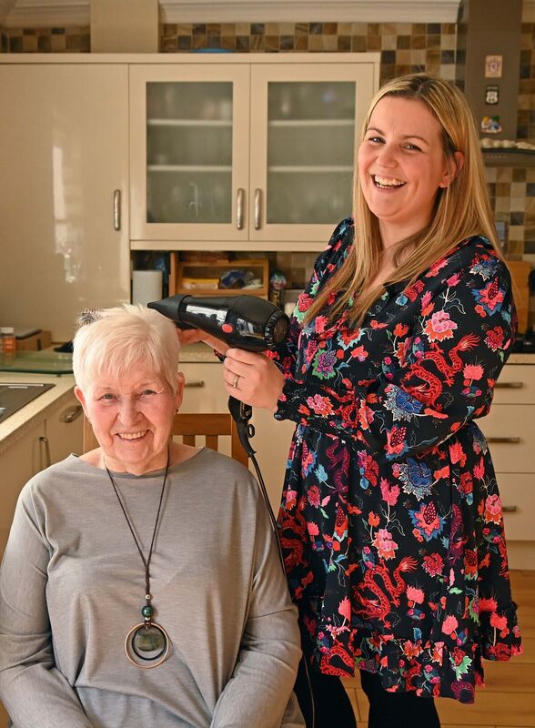 Amanda Gowers of Amaethyst Hair, freelance hair stylist, visiting Maureen O'Dwyer in Cork to cut and style her hair. Picture: Denis Minihane.