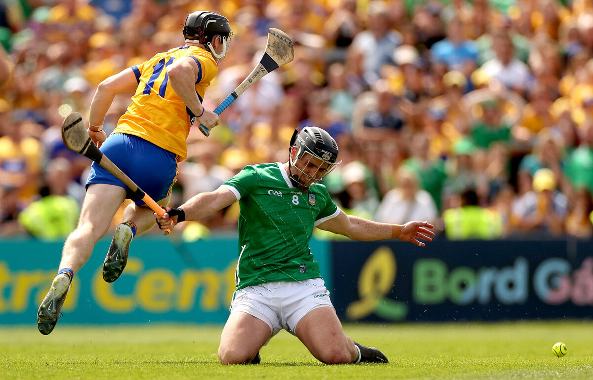 Clare’s Tony Kelly and Darragh O'Donovan of Limerick hunt the sliotar. Picture: INPHO/James Crombie